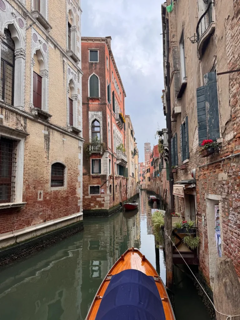 Picturesque canal view in Venezia Italy with gondola and historic buildings